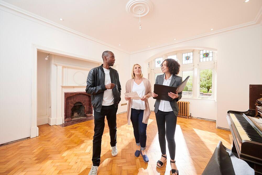 Couple being shown new home.