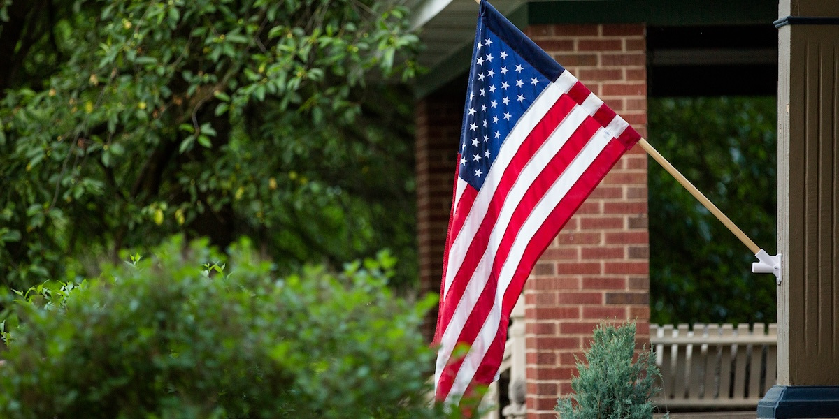 American flag displayed on the front of house.