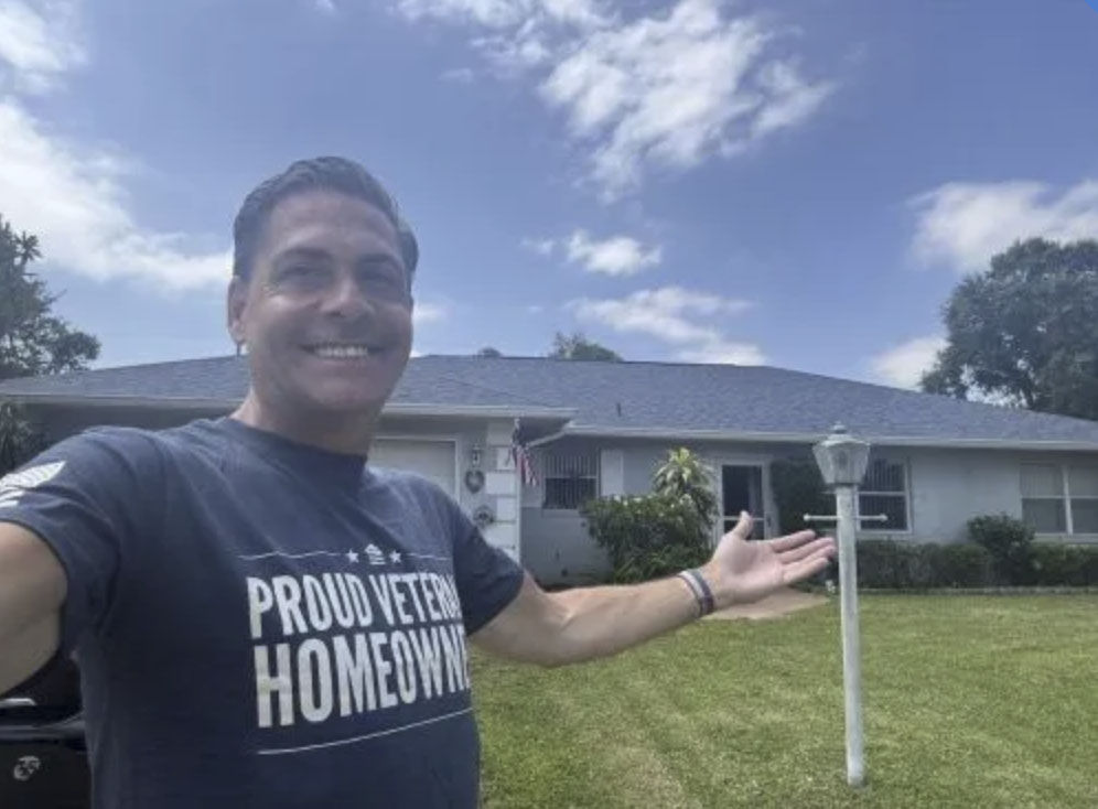 picture of Robert B. in front of a house