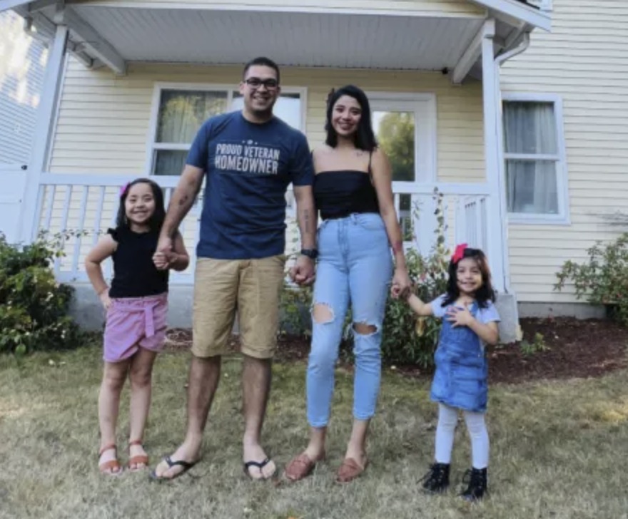 picture of Daniel H. in front of a house